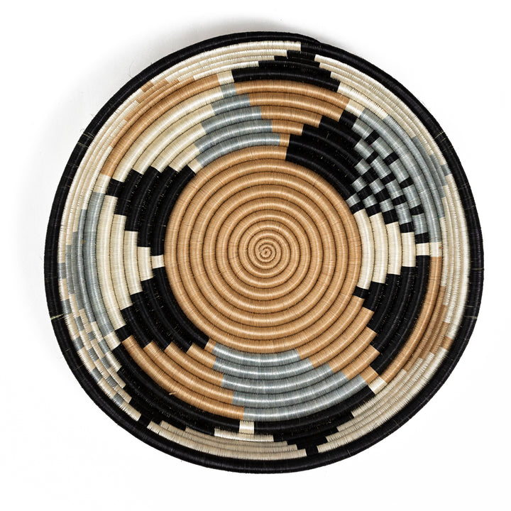 Overhead view of a large Boutique Diversiform woven bowl in gray, slate-blue, and camel.