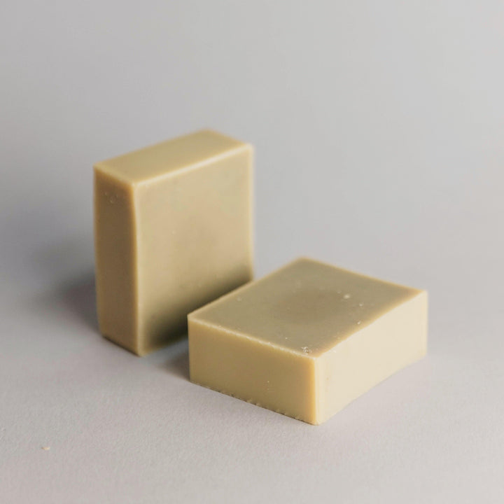 Eucalyptus and lavender bar soap shown with branded kraft paper packaging and herbal ingredient detail.