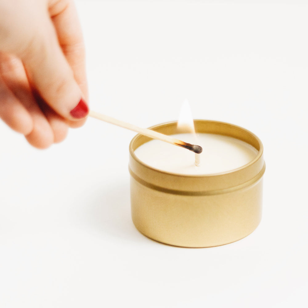 Eucalyptus lavender soy candle in a brushed gold travel tin.
