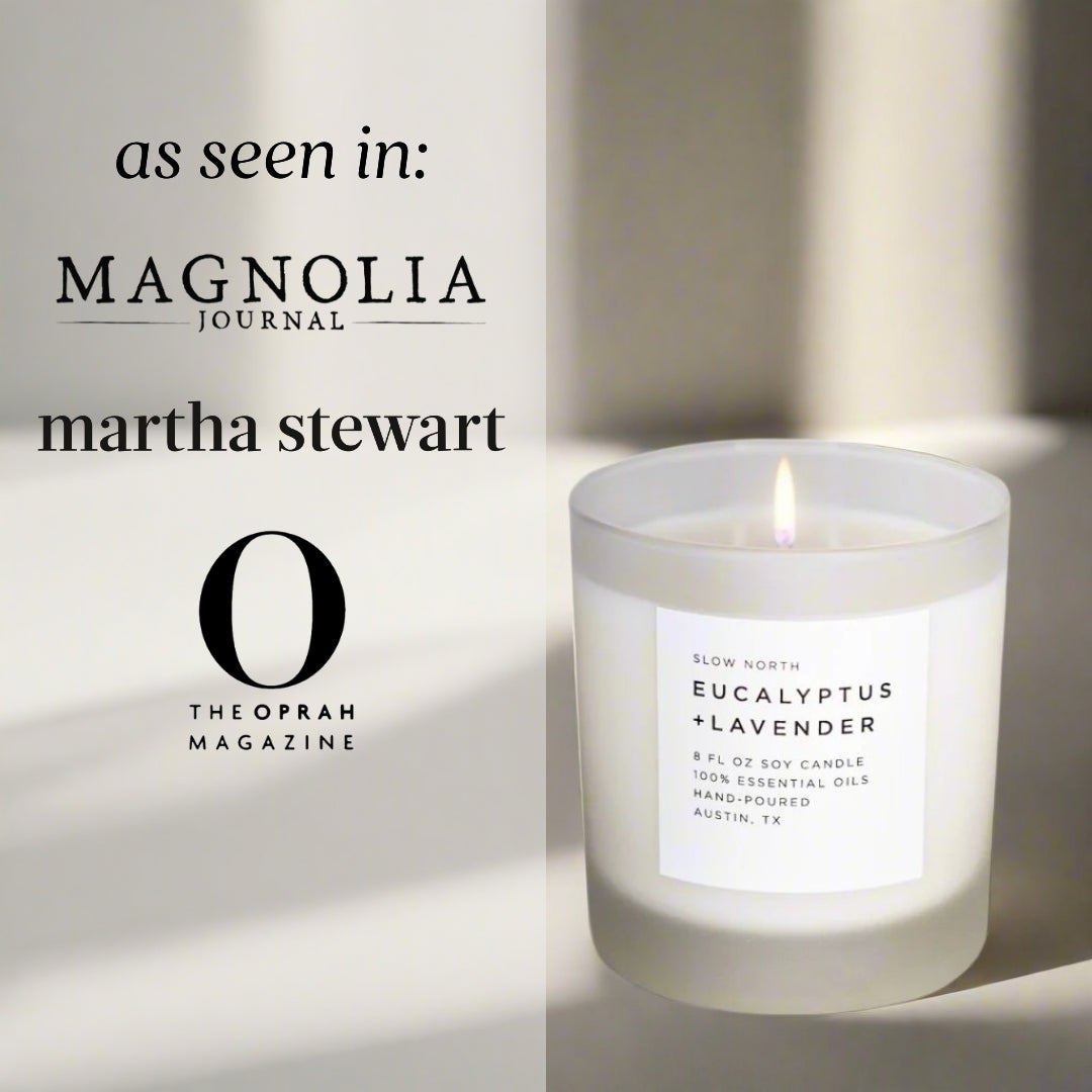 Eucalyptus lavender soy candle in a glass jar with botanical accents.