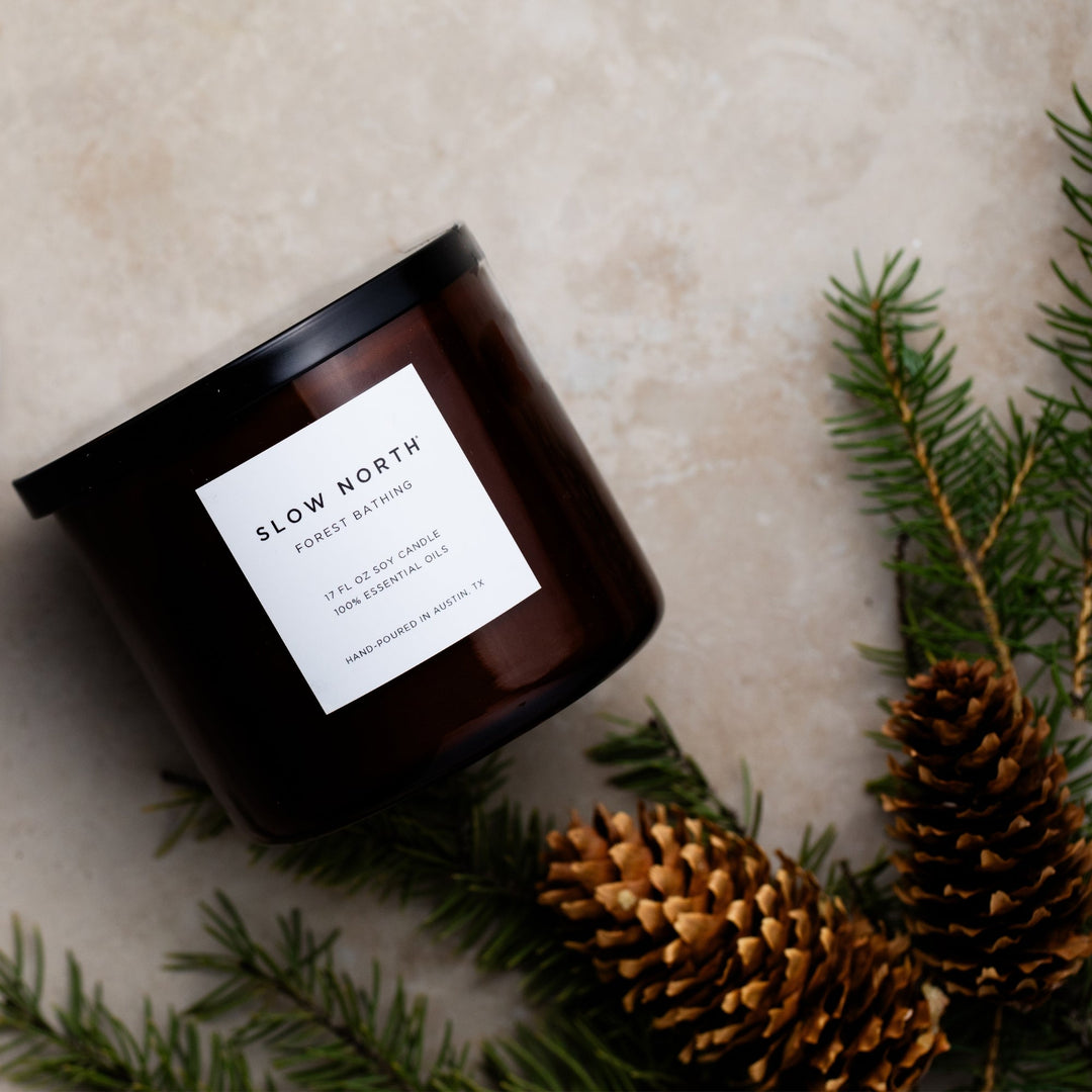 Forest Bathing three-wick candle with natural design and relaxing glow.