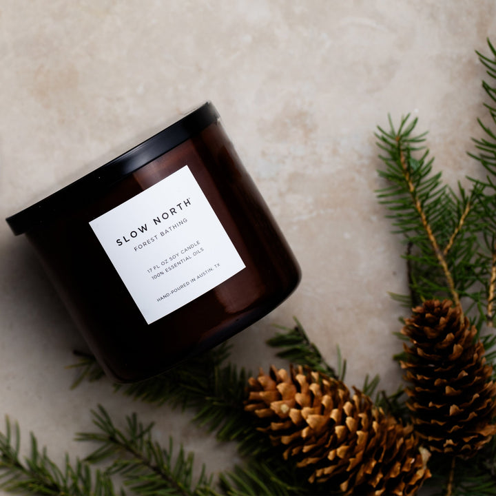 Forest Bathing three-wick candle with natural design and relaxing glow.