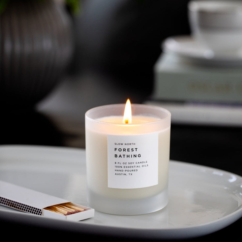 Forest Bathing candle with natural earthy design in a clean container.