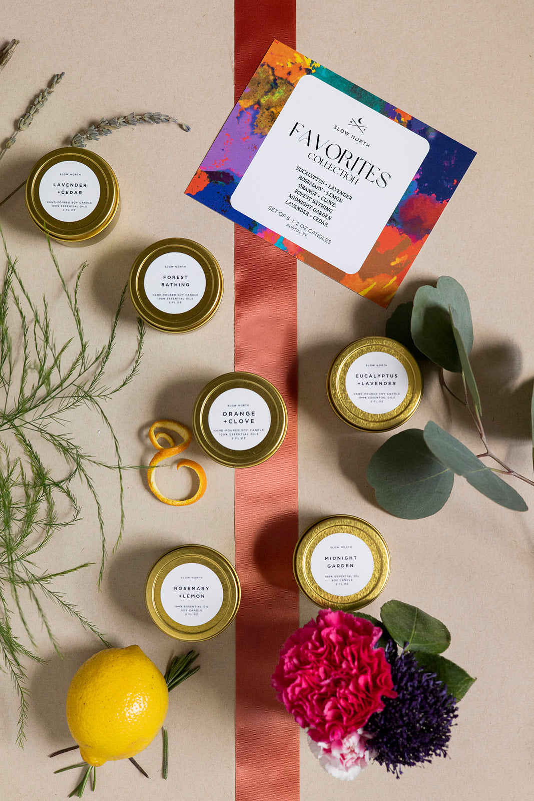 Six Favorites Collection mini candles in tin containers with various scents.