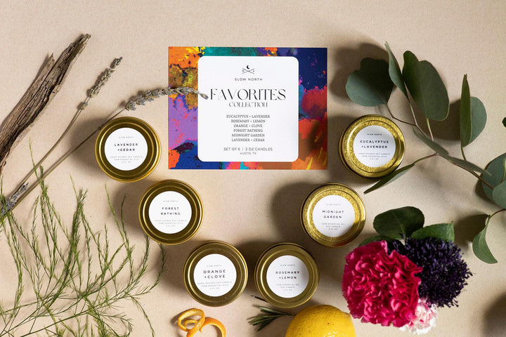 Six mini tin candles from the Favorites Collection in small decorative tins.