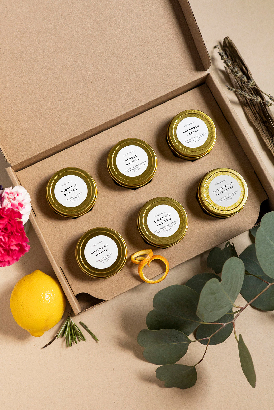 Six mini tin candles from the Favorites Collection with cozy candle designs.