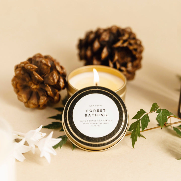 Forest Bathing travel tin candle with calming forest scene label.