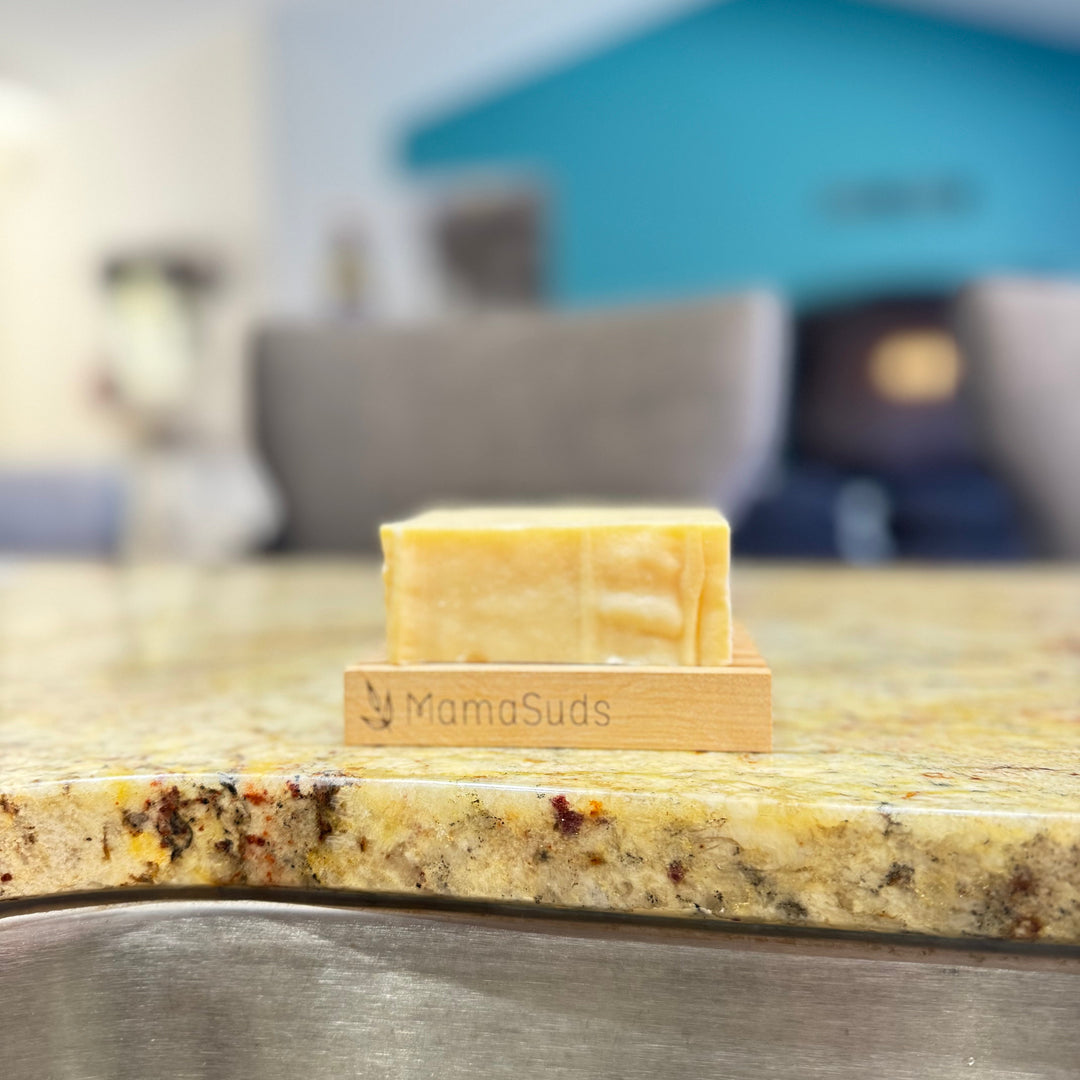 Solid castile dish soap bar with natural packaging.