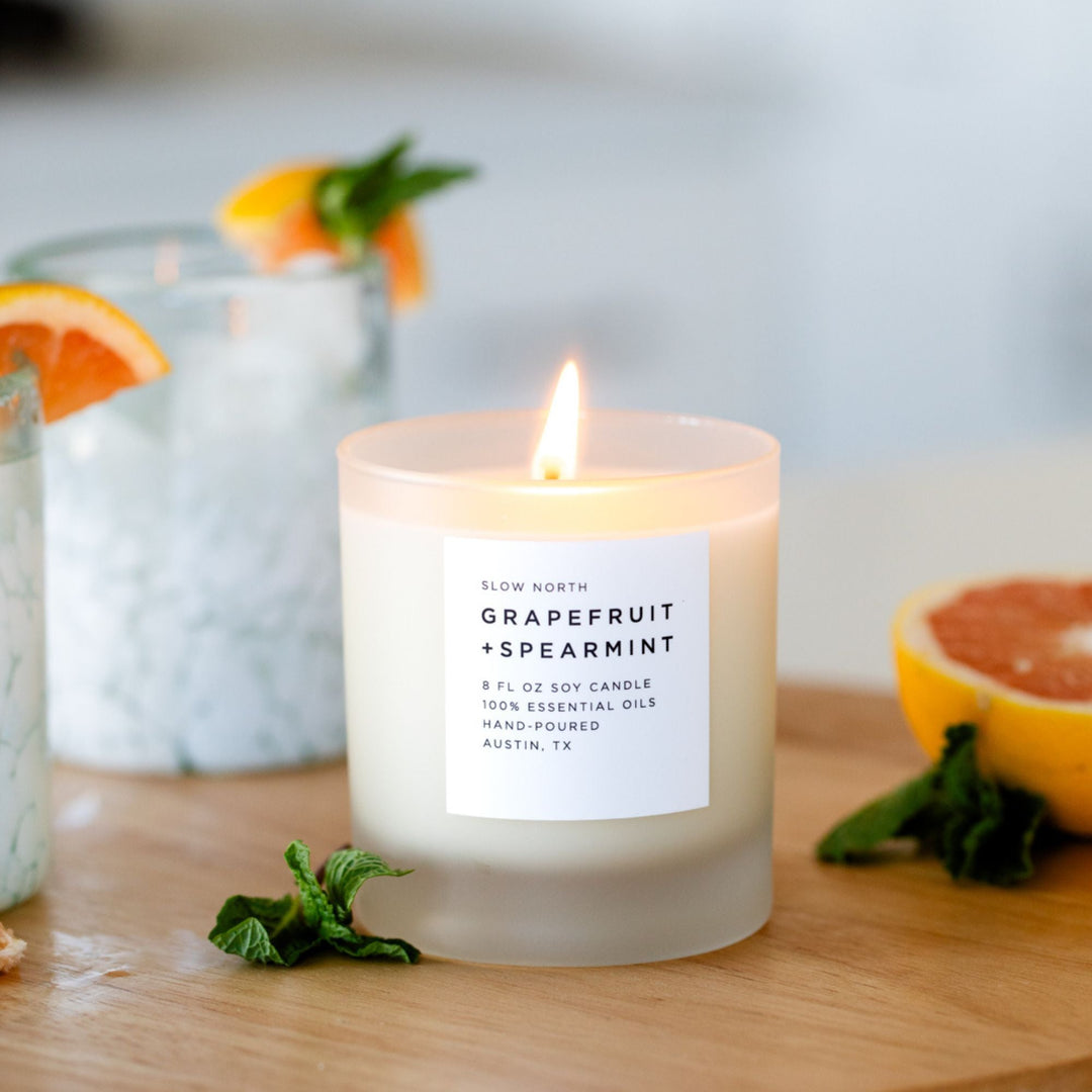 Grapefruit Spearmint signature candle with white wax in a clear glass jar.