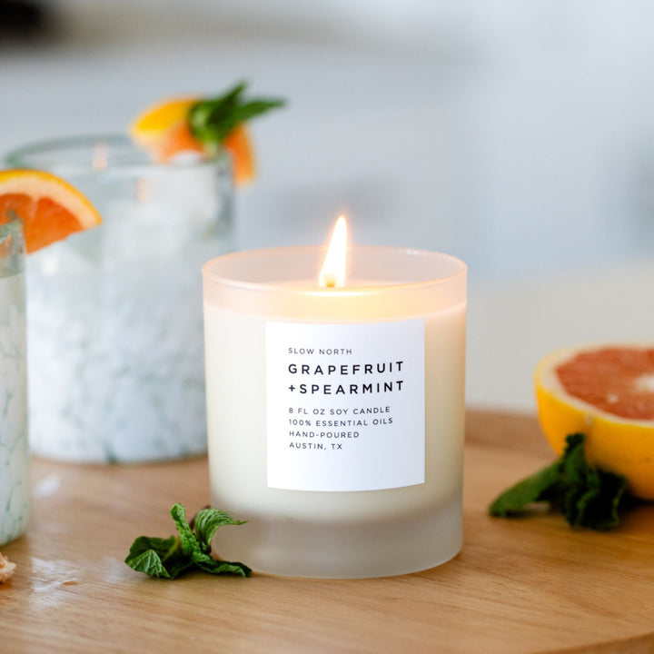 Grapefruit Spearmint signature candle with white wax in a clear glass jar.
