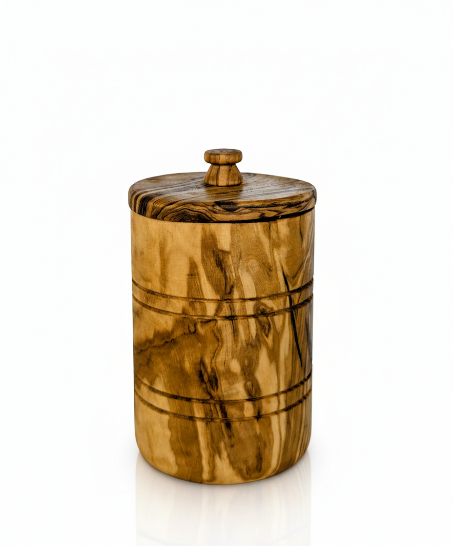 Hand-carved olive wood spice jar with lid, showcasing natural wood grain and craftsmanship.