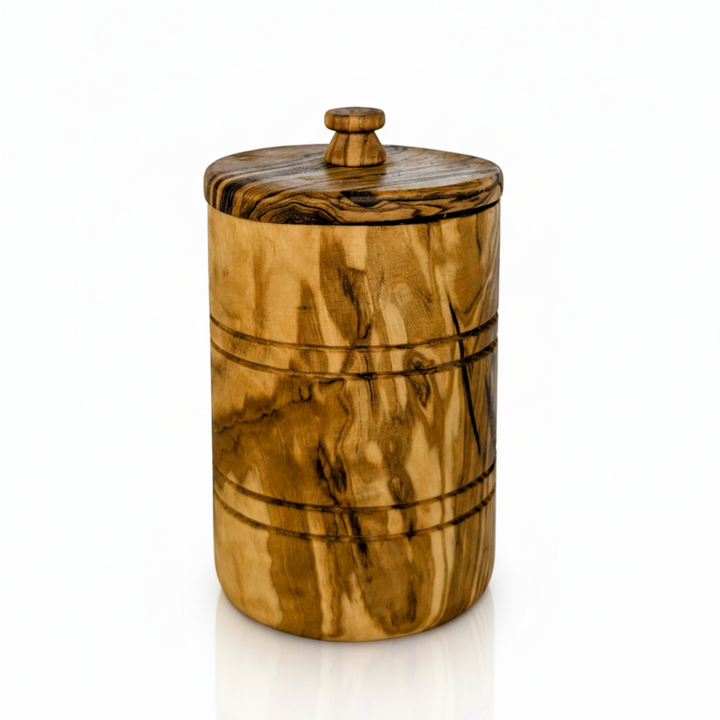 Hand-carved olive wood spice jar with lid, showcasing natural wood grain and craftsmanship, ideal for kitchen storage and spice organization.