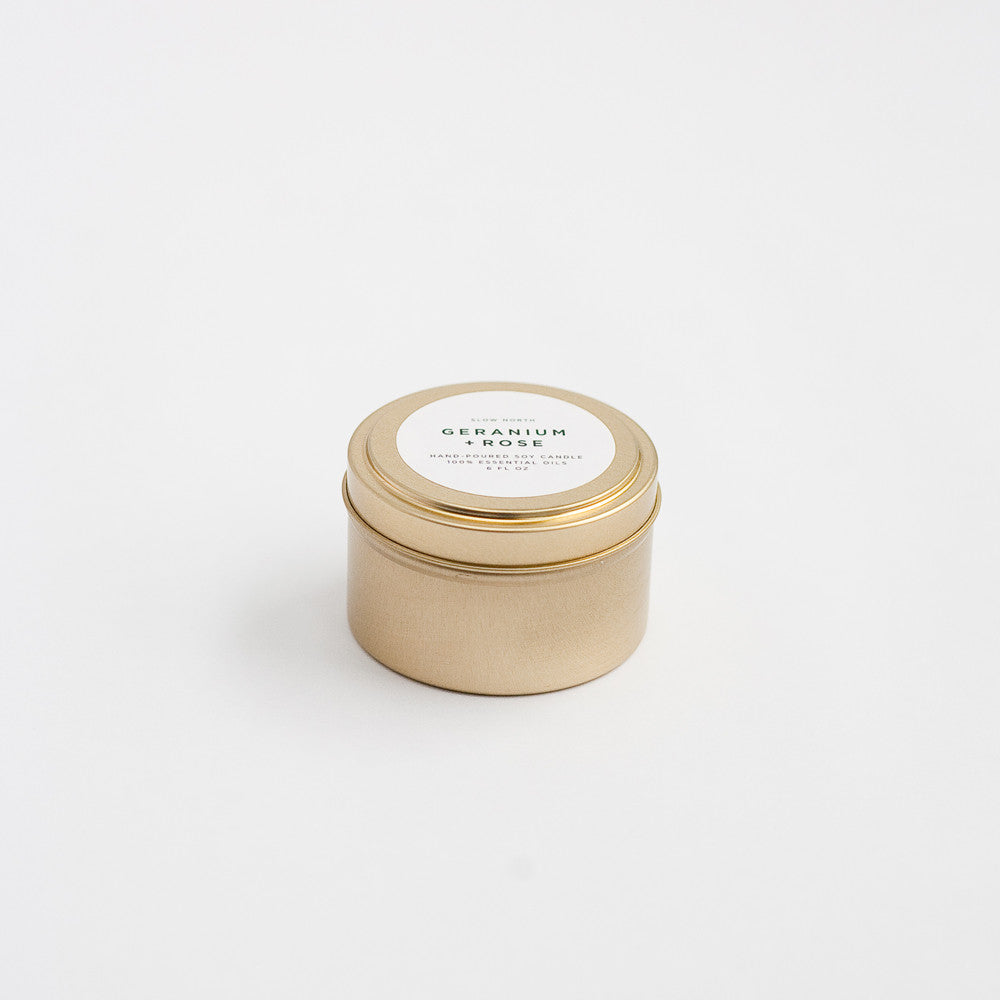 Geranium Rose soy candle in a compact brushed gold travel tin.