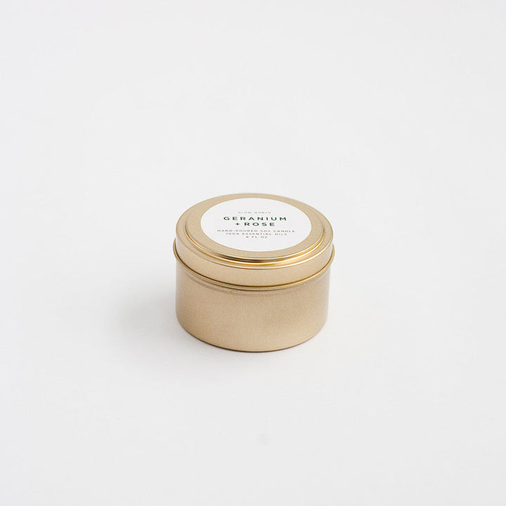 Geranium Rose soy candle in a compact brushed gold travel tin.