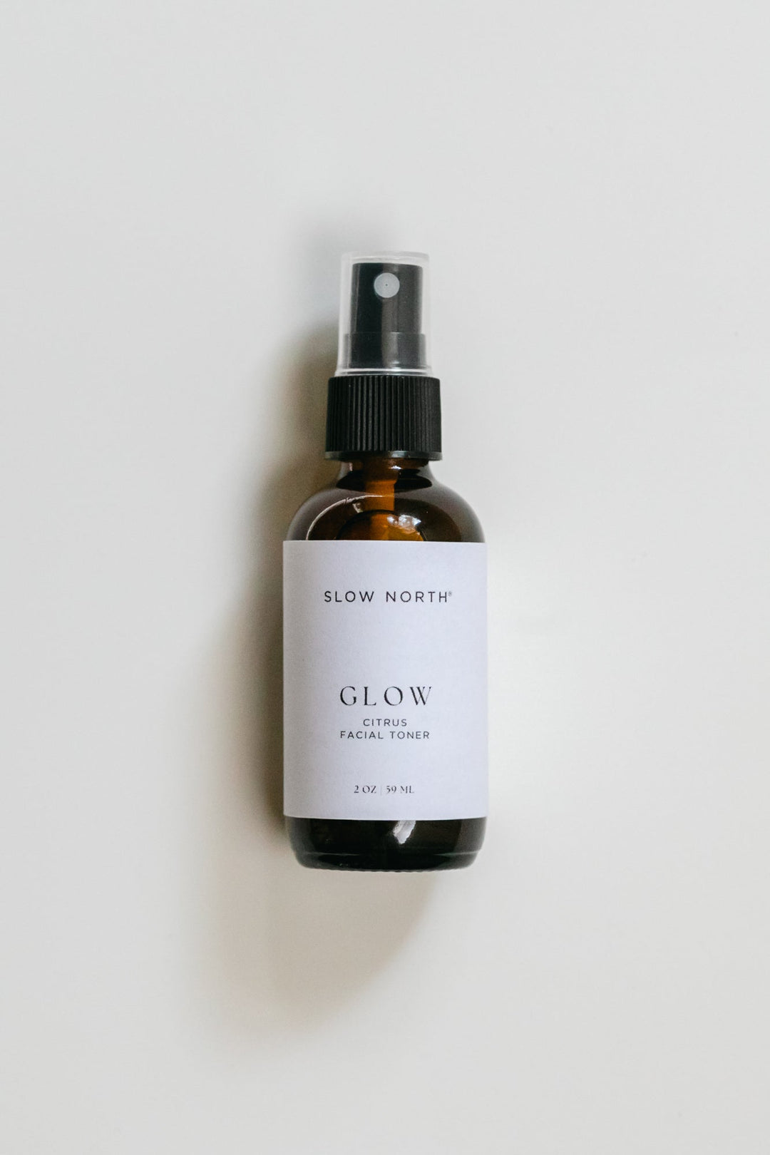 Bright citrus toner in a clear bottle with rose water and essential oils.
