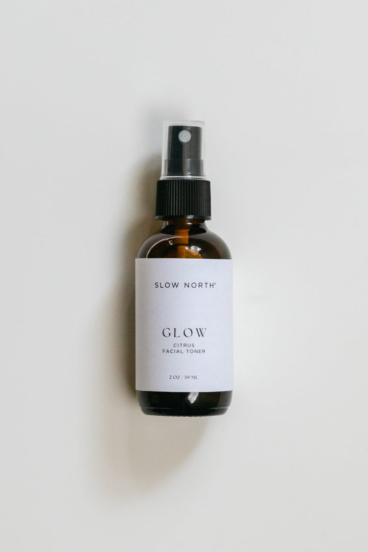 Bright citrus toner in a clear bottle with rose water and essential oils.