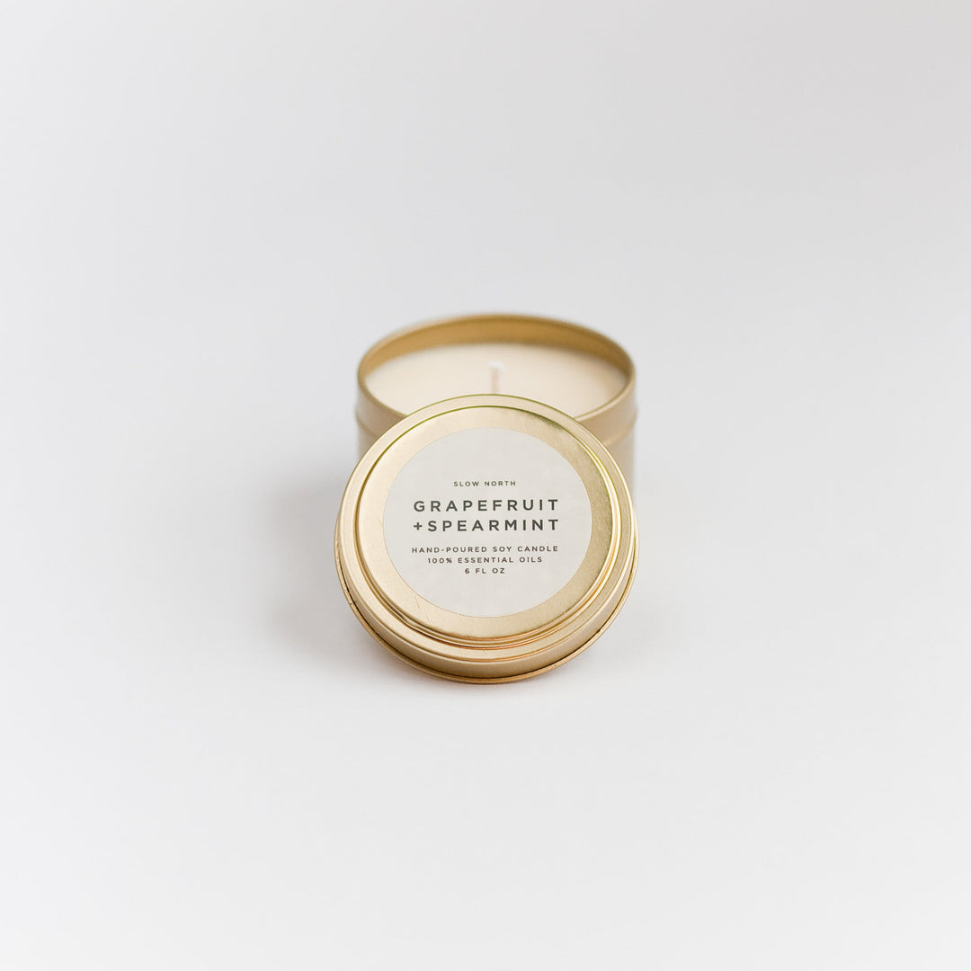 Grapefruit spearmint travel tin candle with fresh citrus and mint scent.