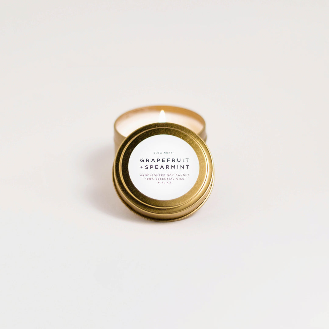 Grapefruit spearmint travel tin candle with fresh citrus and mint aroma.