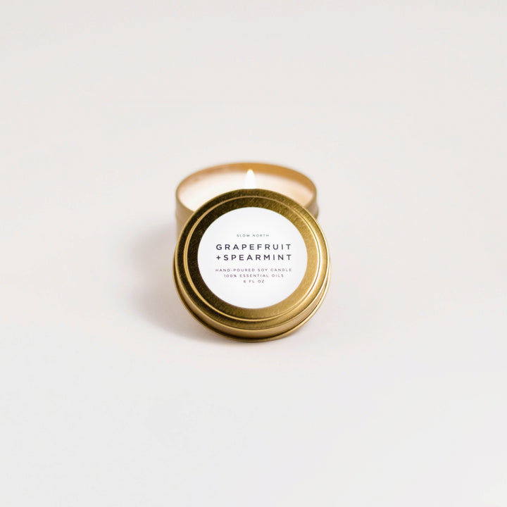 Grapefruit spearmint travel tin candle with fresh citrus and mint aroma.