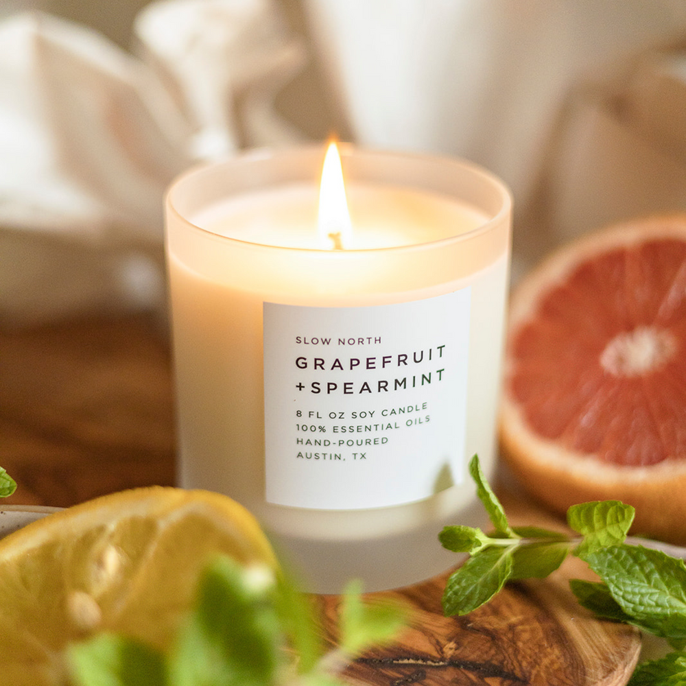 8 oz Grapefruit Spearmint signature candle with white wax in a glass jar.