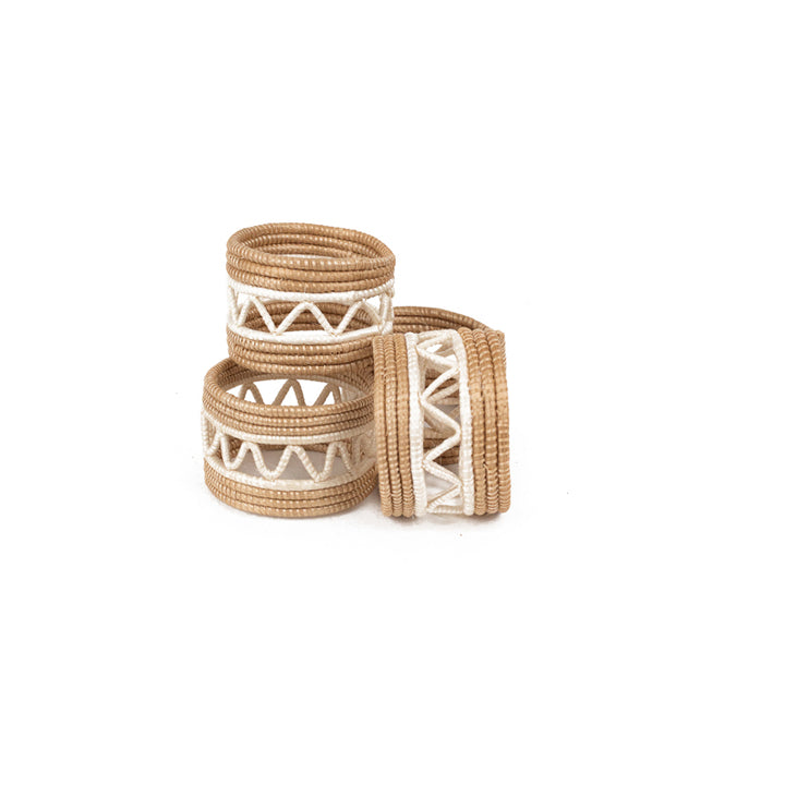 Handwoven sisal napkin rings with a zig-zag basket weave in natural white.