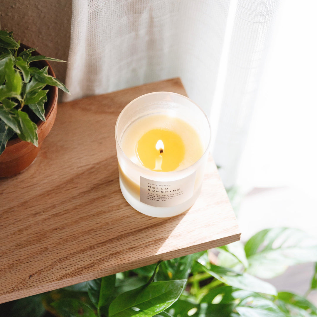 8 oz Hello Sunshine signature candle with citrus blend label.