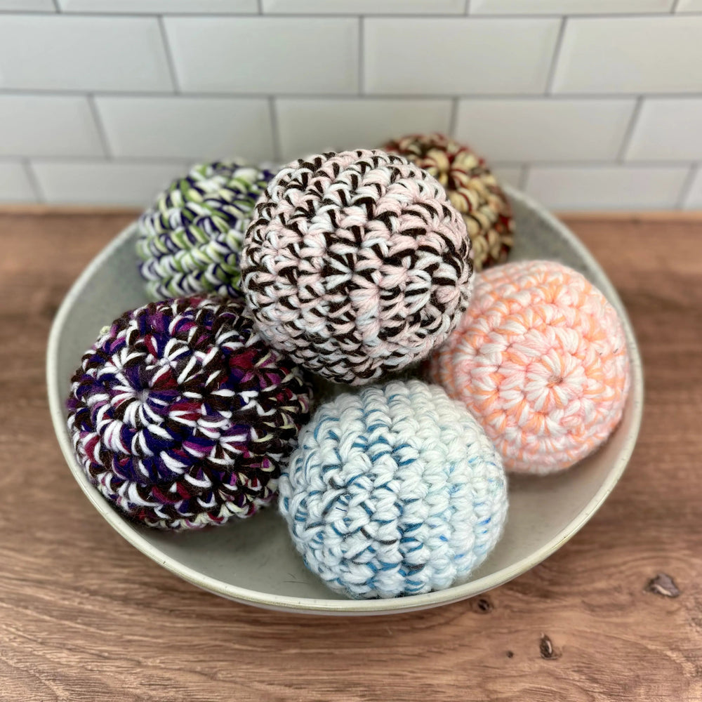 Handmade dryer ball from upcycled textiles, for softening laundry naturally.