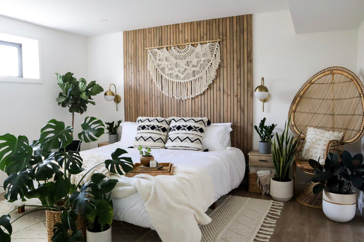 Natural white macrame wall hanging with intricate knotted patterns.