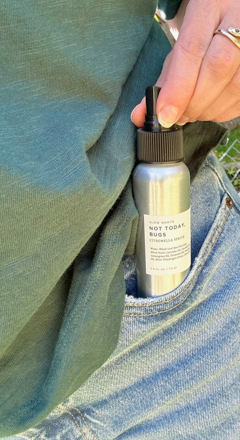 Mini bug spray bottle with lavender, citronella, and lemongrass essential oils.