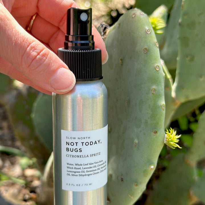 Compact bug spray bottle with botanical insect repellent formula.