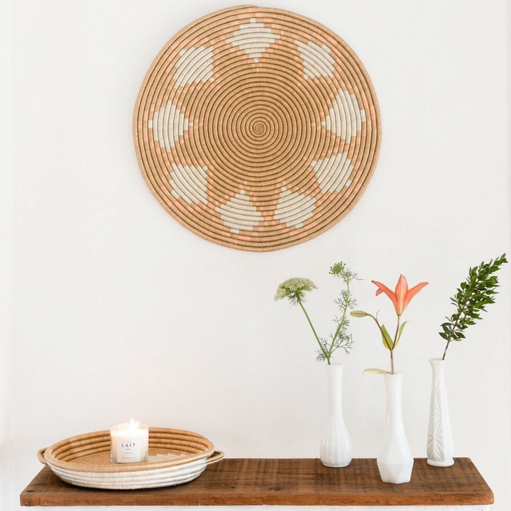 Neri flat woven sisal wall hanging with an intricate circular pattern.