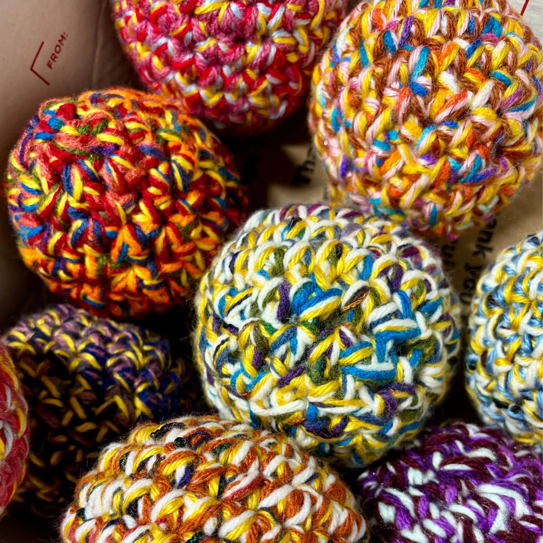 Handmade dryer ball from upcycled materials, used to reduce drying time.