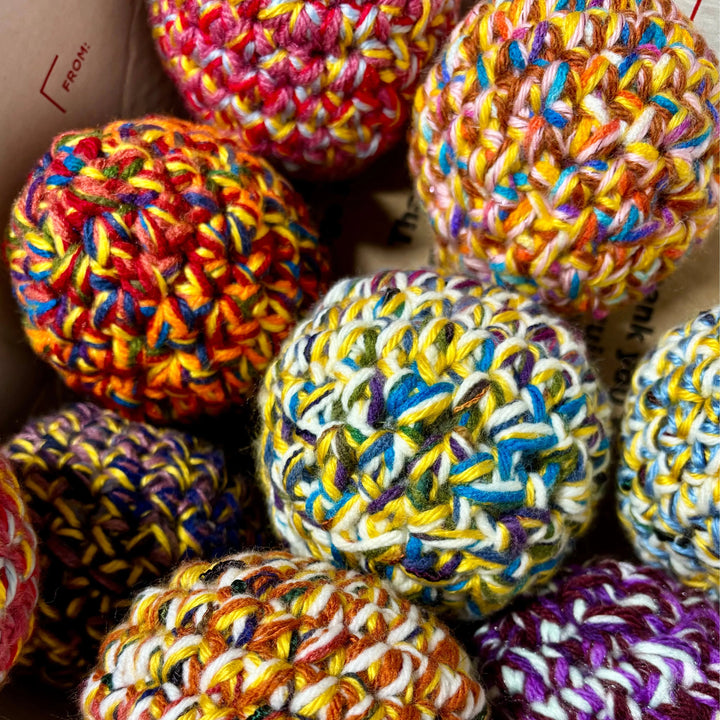 Handmade dryer ball from upcycled materials, used to reduce drying time.