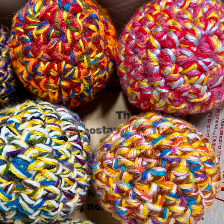 Handmade dryer ball from upcycled yarn and fabric, for the dryer.