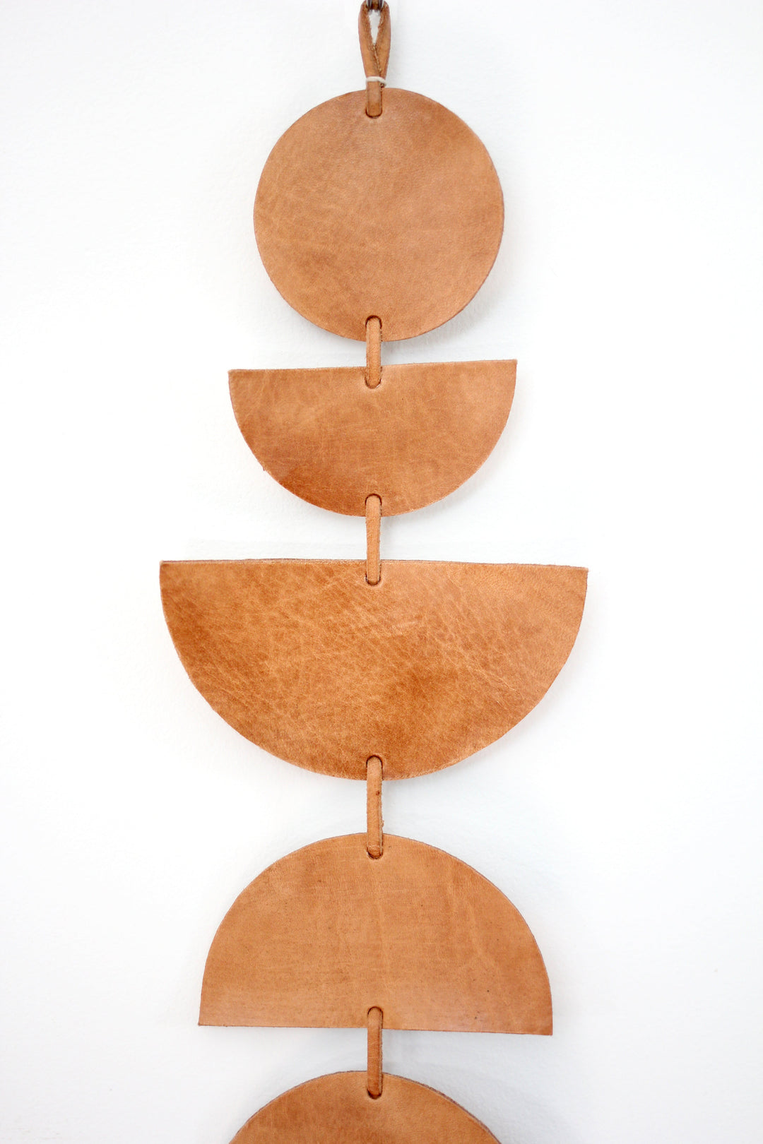 Large leather Luna moon-phase wall hanging showing the moon phases.