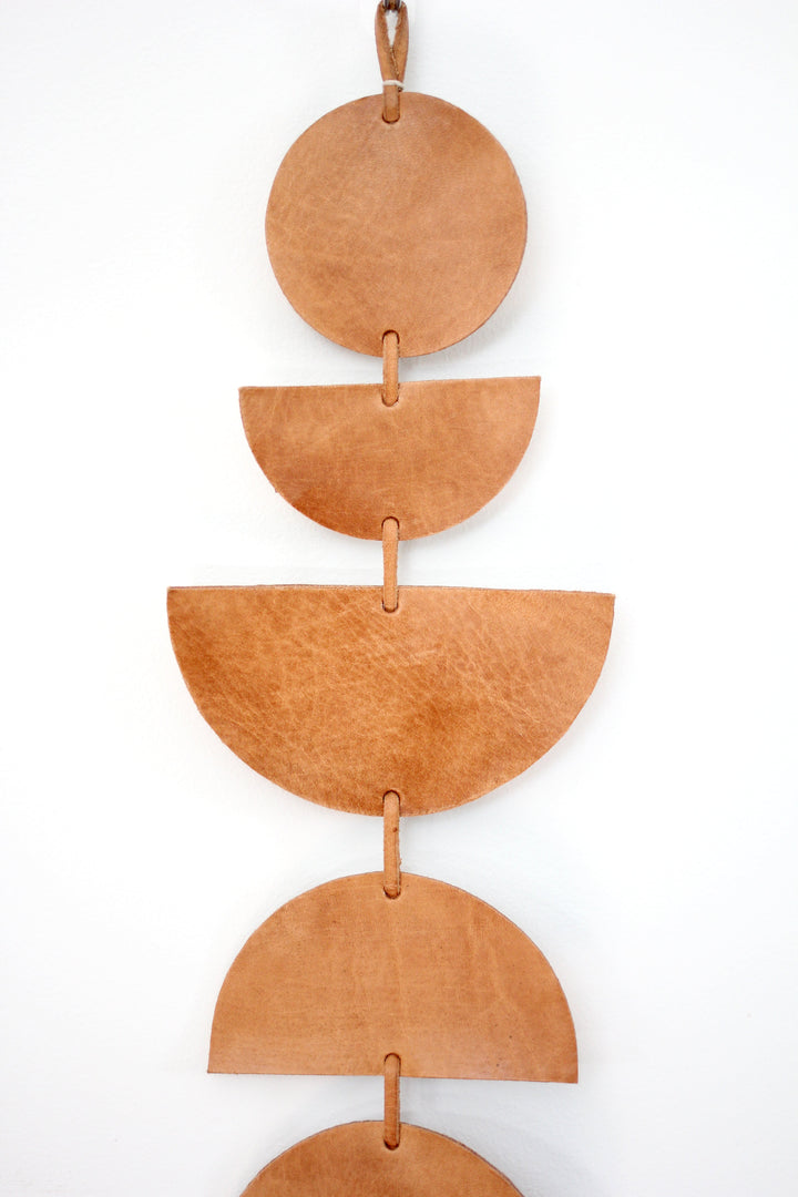 Large leather Luna moon-phase wall hanging showing the moon phases.