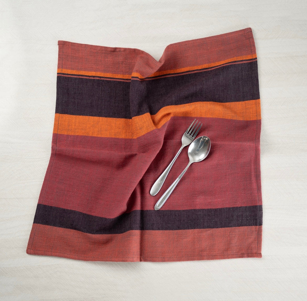 Color block napkin laid open with a spoon and fork