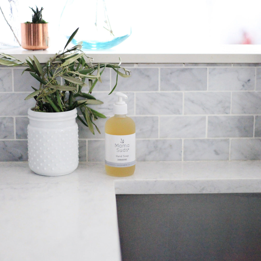 Olive oil and lemon hand soap in a clear pump bottle with lemon and olive-oil label art.