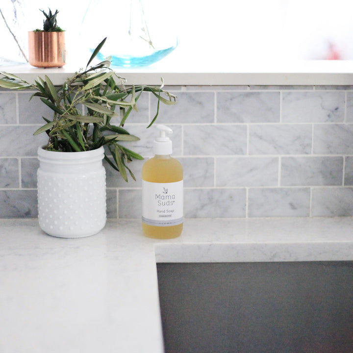 Olive oil and lemon hand soap in a clear pump bottle with lemon and olive-oil label art.