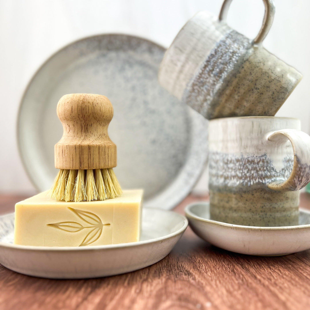 Solid castile dish soap bar with a textured surface.