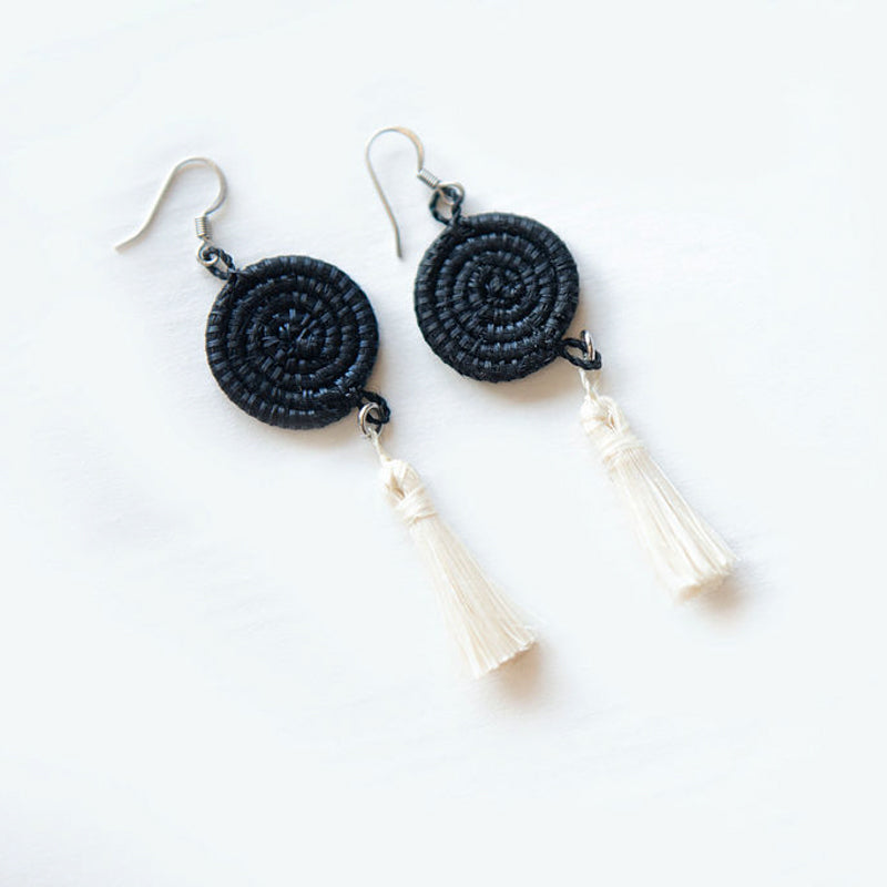 Black and white handwoven sisal tassel earrings with fringe detail.