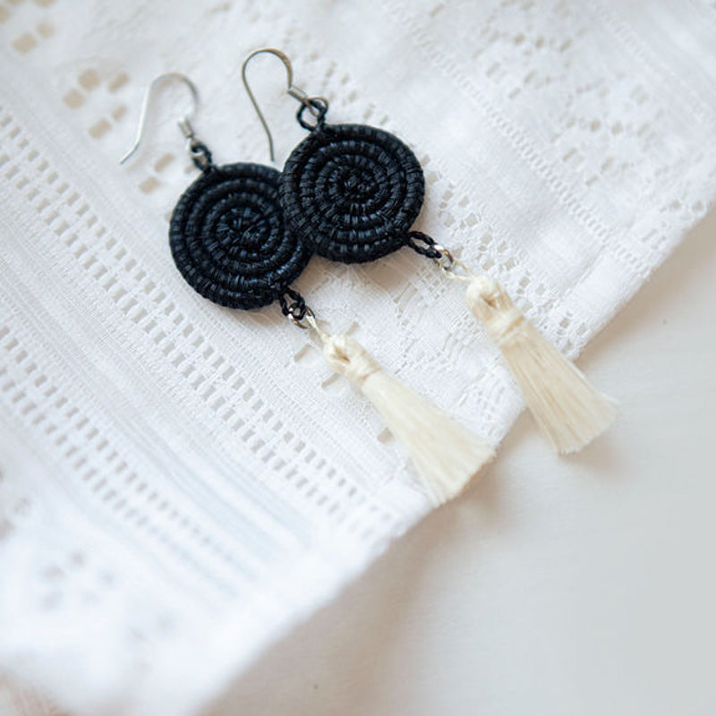 Black handwoven sisal tassel earrings with intricate weaving.