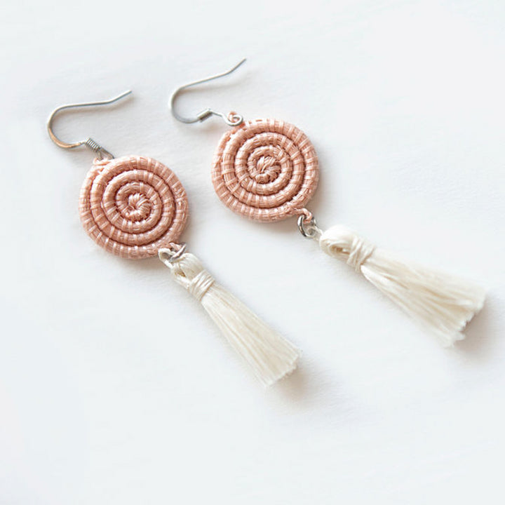 Blush handwoven sisal tassel earrings with woven tassel detail.