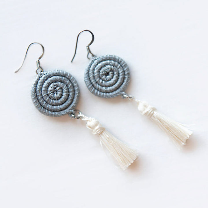 Ice blue handwoven sisal tassel earrings with intricate detail.