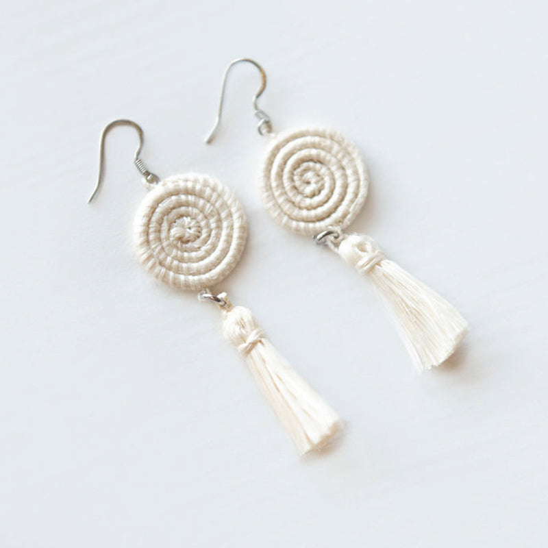 White handwoven sisal tassel earrings with a natural-fiber tassel design.