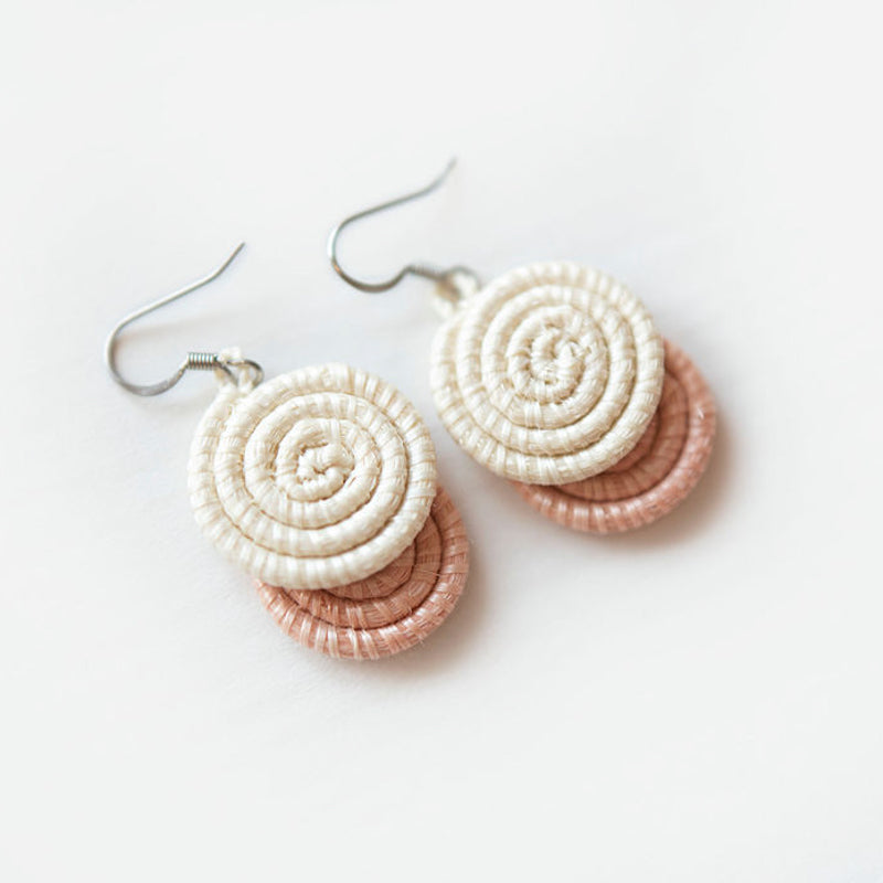 Blush woven disc earrings made from sisal fiber, lightweight and handcrafted.