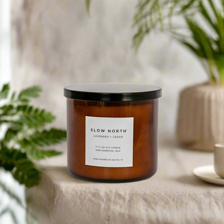 Lavender Cedar three-wick candle in a clear glass jar with natural soy wax.