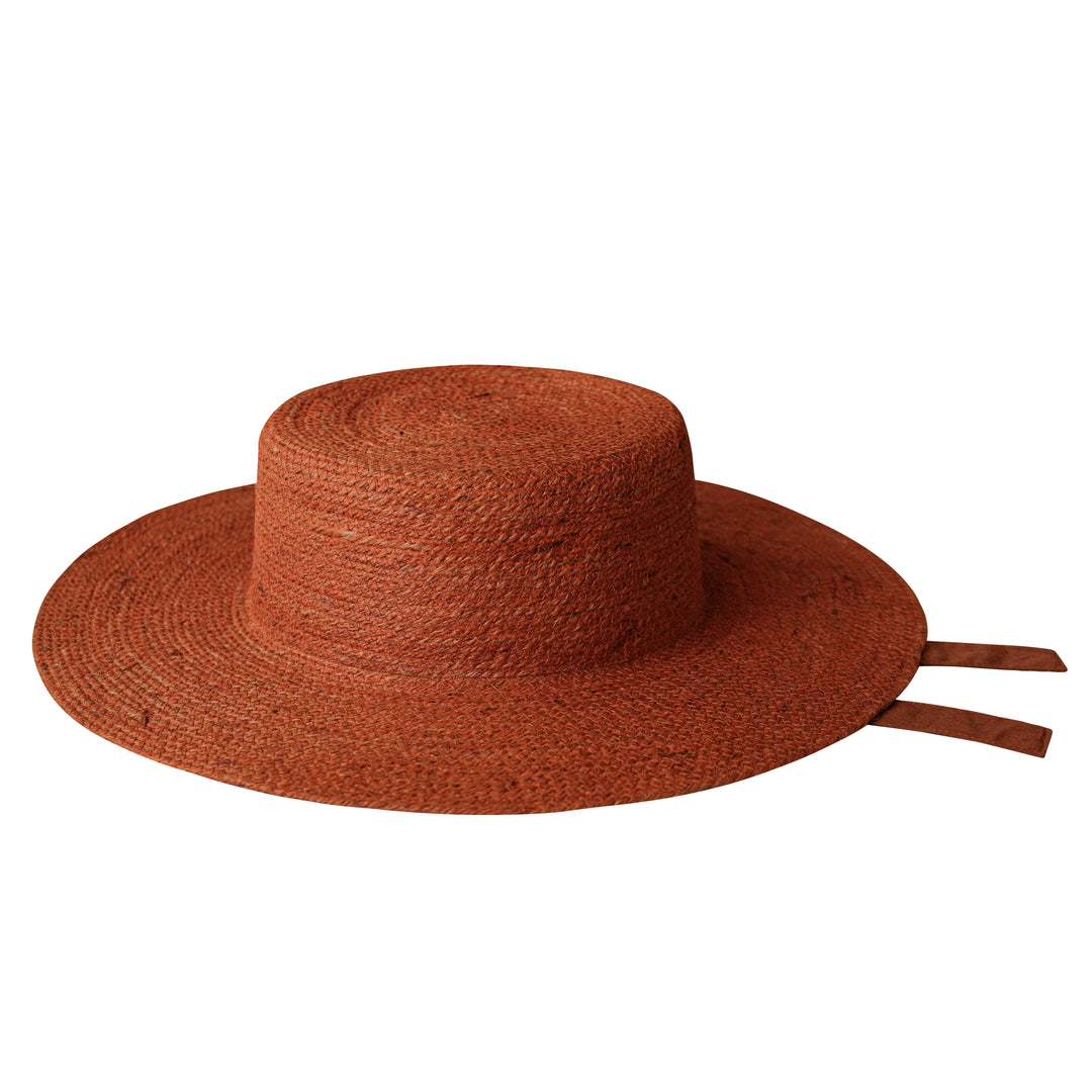 Natural jute hat in burnt sienna with a wide brim for sun coverage on sunny days.