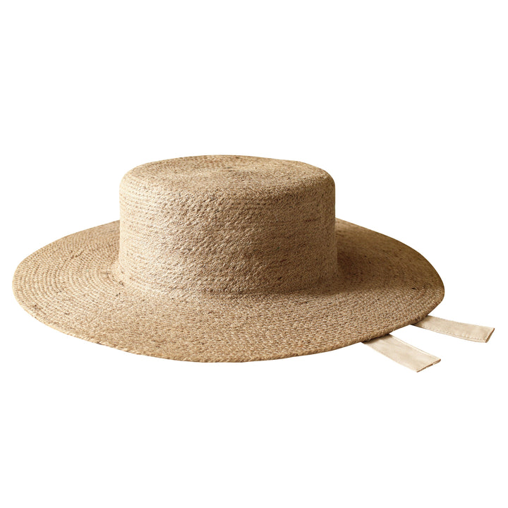 Neutral beige jute straw hat featuring a wide brim and casual summer style.