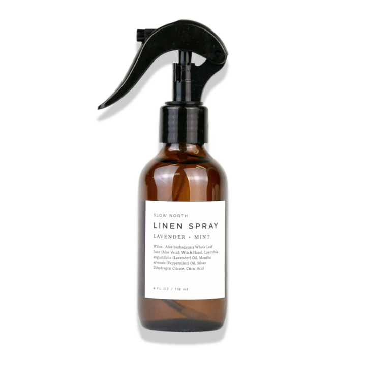 Lavender mint linen spray in a glass spray bottle with botanical accents.